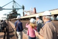 Canadian journalists watch iron ore being unloaded from ship at Hyundai Steel