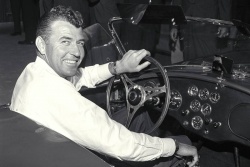 Carroll Shelby at wheel of new production Cobra, 1963